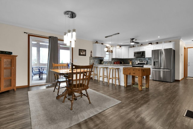 191 Craig Dr, Thornville, OH 43076 - dining area featuring baseboards, recessed lighting, visible vents, dark wood finished floors, and ceiling fan with notable chandelier