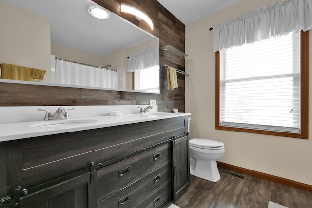 191 Craig Dr, Thornville, OH 43076 - bathroom with visible vents, a sink, toilet, double vanity, and wood finished floors