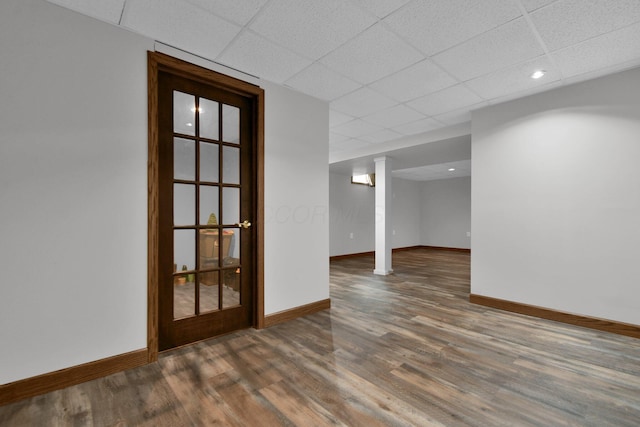 191 Craig Dr, Thornville, OH 43076 - spare room featuring a drop ceiling, baseboards, and wood finished floors
