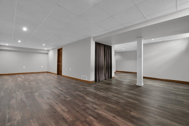 191 Craig Dr, Thornville, OH 43076 - finished basement featuring dark wood-style flooring, baseboards, visible vents, and a drop ceiling