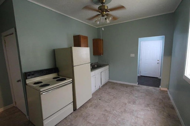 kitchen featuring white appliances, a ceiling fan, ornamental molding, a sink, and baseboards