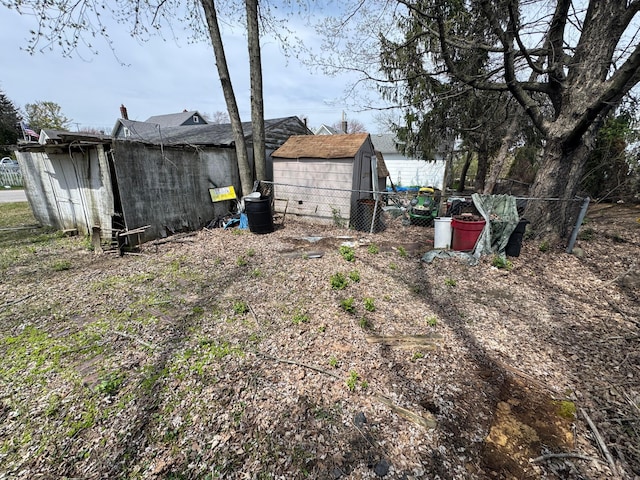 6927 Rings Rd, Dublin, OH 43016 - view of yard featuring an outbuilding, a shed, and fence