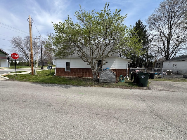 6927 Rings Rd, Dublin, OH 43016 - view of side of home with brick siding and fence