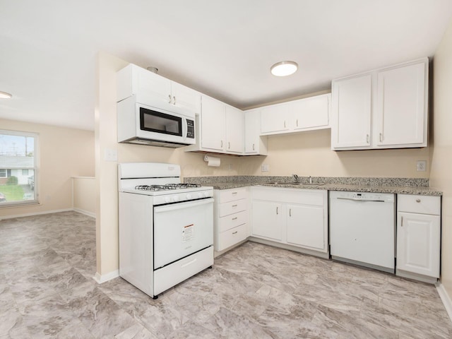 3198 Benham Ct, Columbus, OH 43232 - kitchen featuring white cabinets, baseboards, a sink, and white appliances