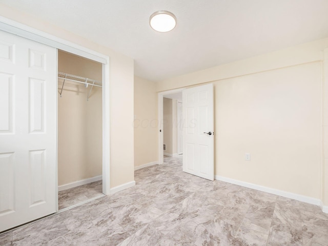 3198 Benham Ct, Columbus, OH 43232 - unfurnished bedroom featuring baseboards and a closet