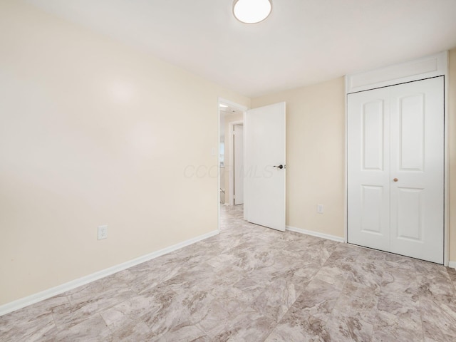 3198 Benham Ct, Columbus, OH 43232 - unfurnished bedroom featuring baseboards and a closet