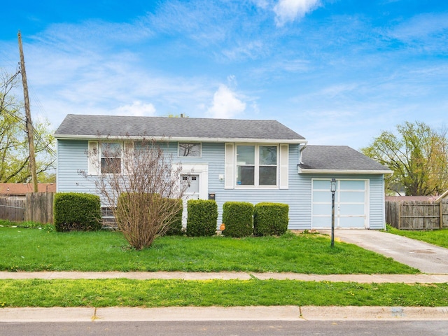 3198 Benham Ct, Columbus, OH 43232 - raised ranch with fence, a garage, a front yard, and concrete driveway