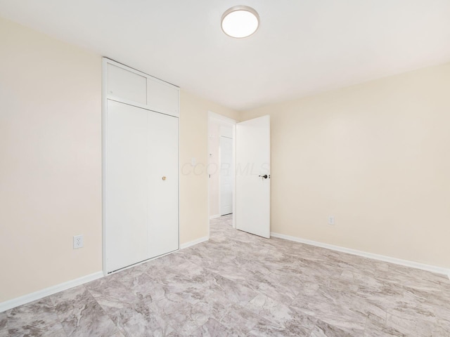 3198 Benham Ct, Columbus, OH 43232 - unfurnished bedroom featuring baseboards and a closet