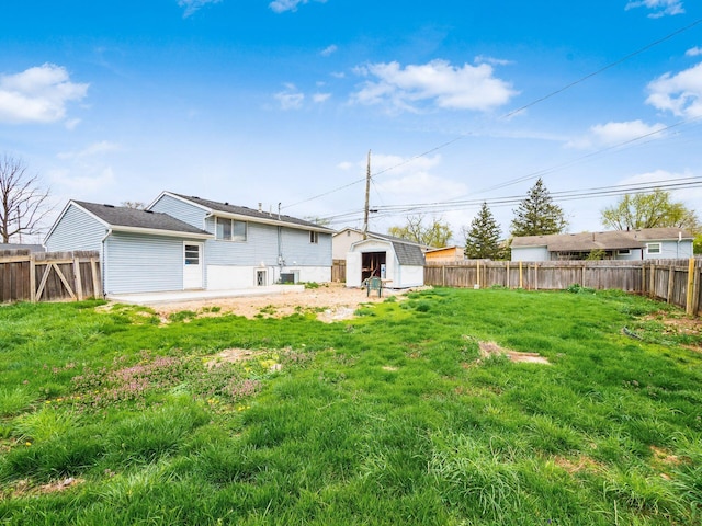 3198 Benham Ct, Columbus, OH 43232 - back of property with a yard, a shed, and a fenced backyard