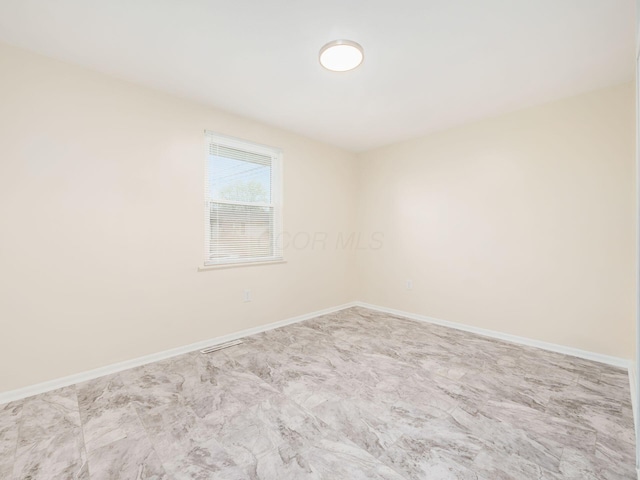 3198 Benham Ct, Columbus, OH 43232 - spare room with baseboards and visible vents
