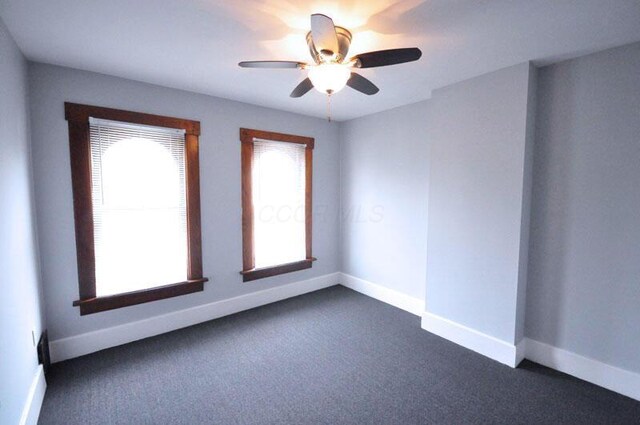 49 Euclid Ave, Columbus, OH 43201 - unfurnished room featuring dark colored carpet, baseboards, and ceiling fan