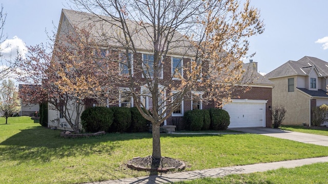 view of front of house featuring an attached garage, a front lawn, brick siding, and concrete driveway