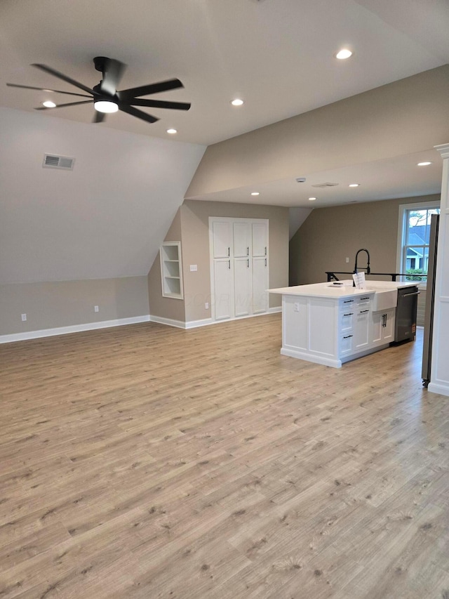 2372 Linden St, Lewis Center, OH 43035 - unfurnished living room with baseboards, ceiling fan, a sink, and light wood-style flooring
