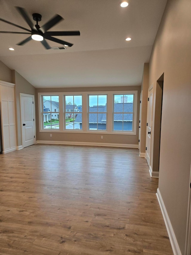 2372 Linden St, Lewis Center, OH 43035 - unfurnished room featuring ceiling fan, visible vents, baseboards, wood finished floors, and vaulted ceiling