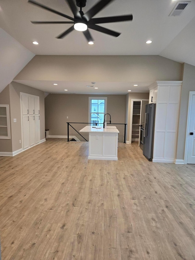 2372 Linden St, Lewis Center, OH 43035 - kitchen featuring high end refrigerator, light wood finished floors, lofted ceiling, and open floor plan