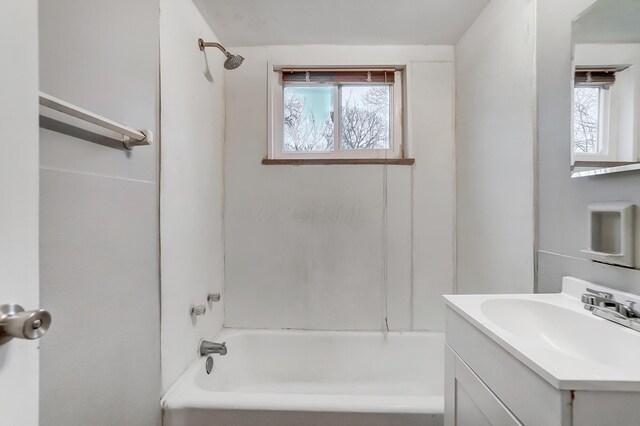 bathroom with shower / washtub combination and vanity