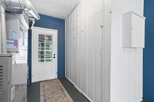 doorway to outside with concrete floors