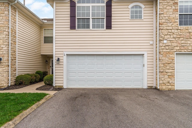 exterior space featuring aphalt driveway