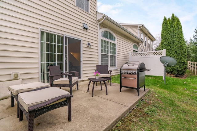 view of patio / terrace with grilling area and fence