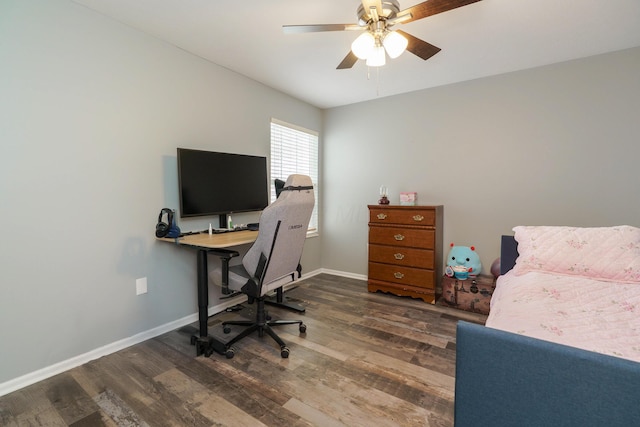 office featuring ceiling fan, baseboards, and wood finished floors
