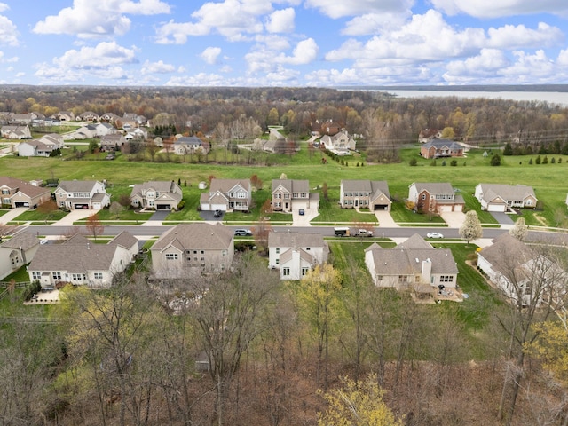 bird's eye view with a residential view and a water view