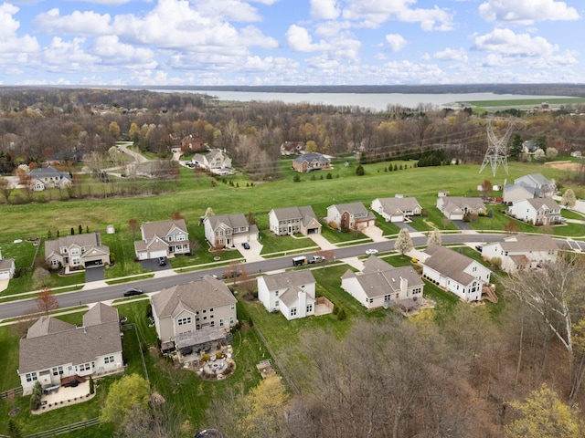 birds eye view of property featuring a residential view and a water view