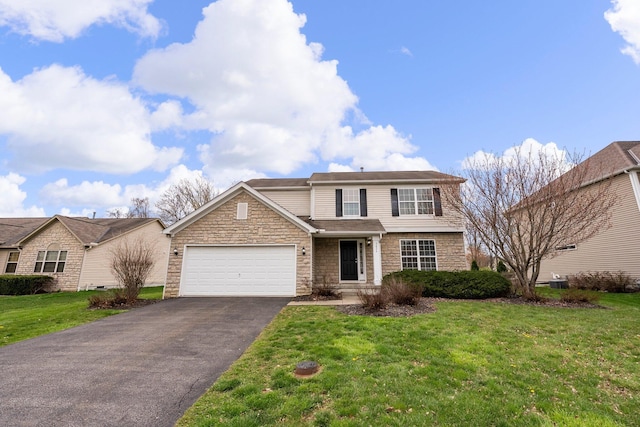 traditional-style house with an attached garage, aphalt driveway, a front yard, and stone siding