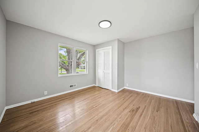 2960 Berwick Blvd, Columbus, OH 43209 - unfurnished bedroom featuring baseboards, a closet, and wood finished floors