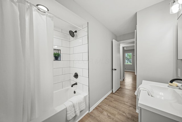 2960 Berwick Blvd, Columbus, OH 43209 - full bathroom featuring shower / tub combo, wood finished floors, baseboards, and vanity