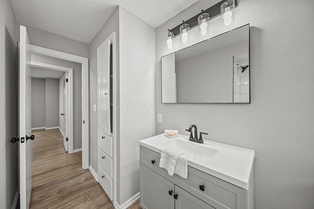 2960 Berwick Blvd, Columbus, OH 43209 - bathroom featuring wood finished floors, vanity, and baseboards