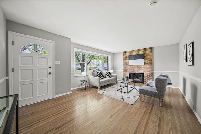2960 Berwick Blvd, Columbus, OH 43209 - living room with wood finished floors, a fireplace, and baseboards