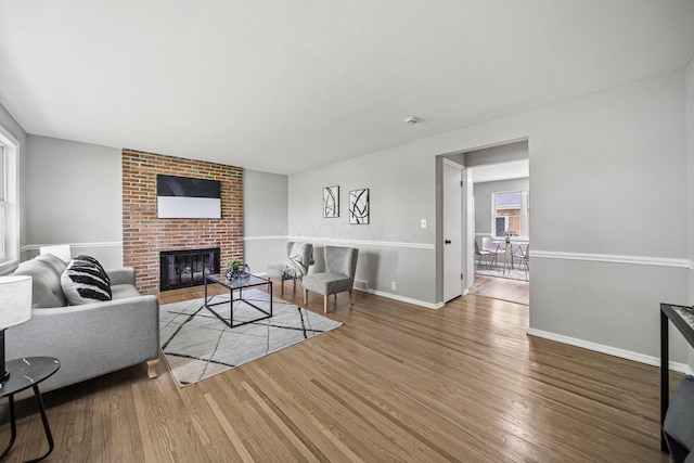 2960 Berwick Blvd, Columbus, OH 43209 - living area featuring wood finished floors, a fireplace, and baseboards