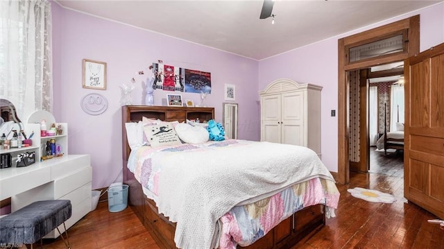 bedroom with hardwood / wood-style flooring and a ceiling fan