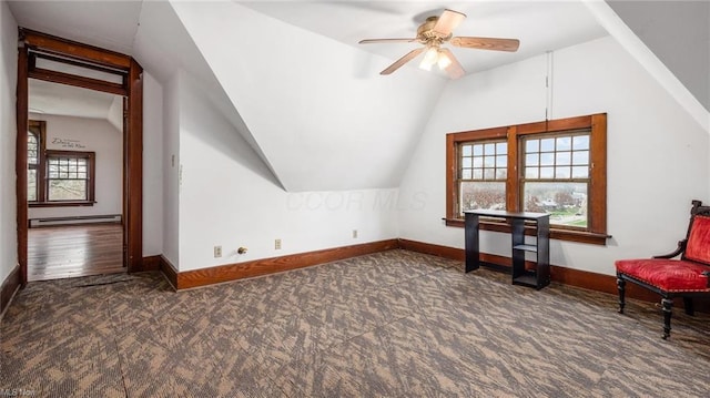 bonus room featuring baseboards, ceiling fan, vaulted ceiling, carpet flooring, and a baseboard heating unit