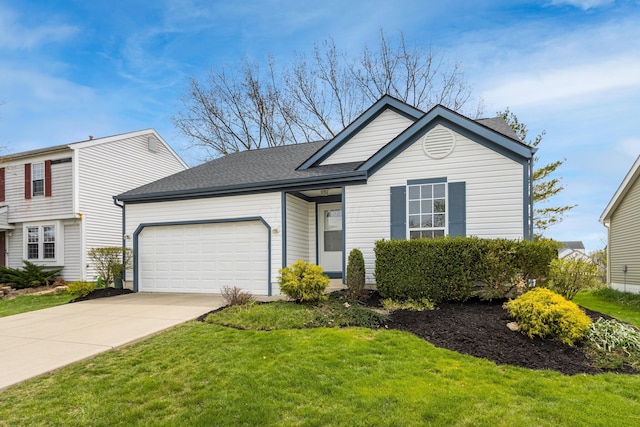view of front of home with an attached garage, driveway, a shingled roof, and a front yard