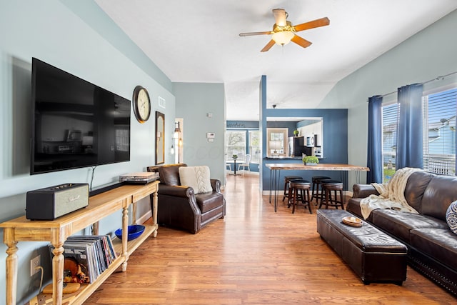 living room featuring wood finished floors and a ceiling fan