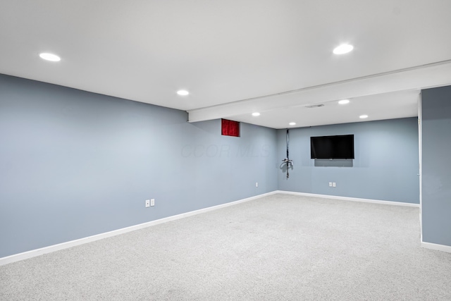 finished below grade area with baseboards, carpet floors, and recessed lighting