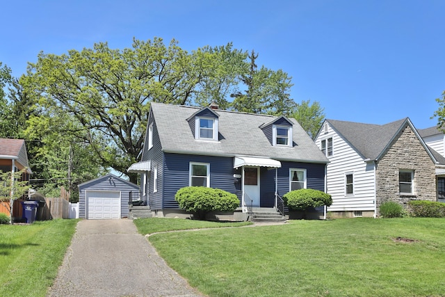 3113 Oaklawn St, Columbus, OH 43224 - cape cod-style house with asphalt driveway, an outbuilding, a front yard, a garage, and entry steps