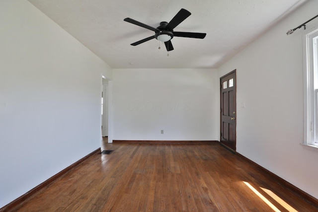 3113 Oaklawn St, Columbus, OH 43224 - spare room with dark wood finished floors, ceiling fan, and baseboards