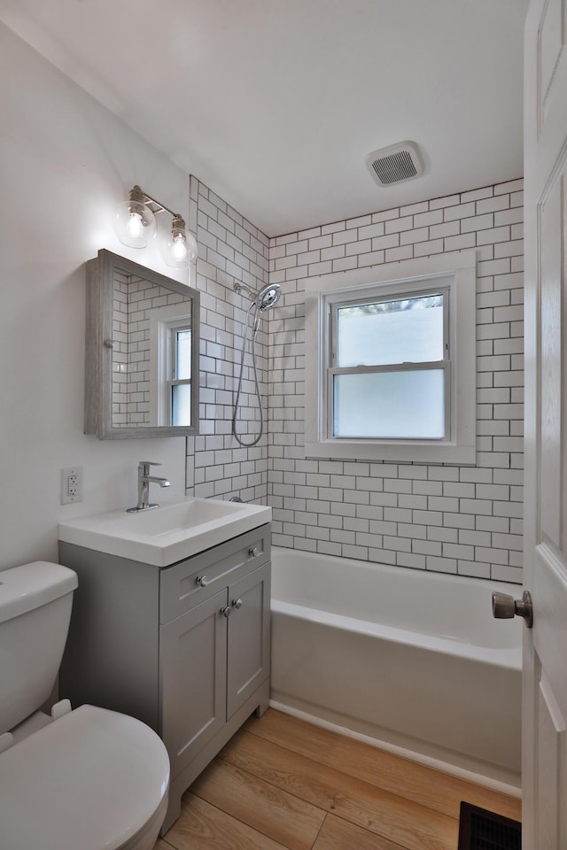 3113 Oaklawn St, Columbus, OH 43224 - full bath with toilet, bathtub / shower combination, wood finished floors, and vanity