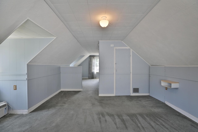 3113 Oaklawn St, Columbus, OH 43224 - additional living space with carpet floors, baseboards, and vaulted ceiling