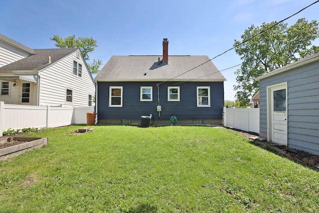 3113 Oaklawn St, Columbus, OH 43224 - rear view of property with a chimney, cooling unit, a garden, and a shingled roof