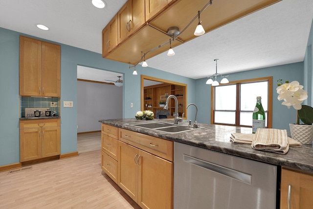 441 Gentlewind Dr, Westerville, OH 43081 - kitchen featuring backsplash, visible vents, stainless steel dishwasher, light wood-type flooring, and a sink