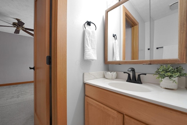 441 Gentlewind Dr, Westerville, OH 43081 - bathroom with vanity, ceiling fan, and a textured ceiling