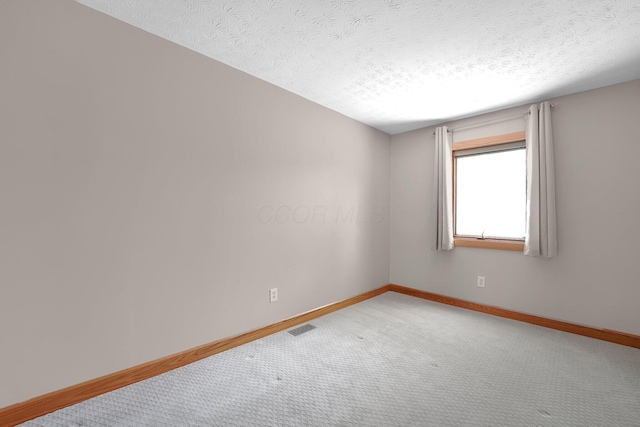 441 Gentlewind Dr, Westerville, OH 43081 - carpeted empty room with baseboards, a textured ceiling, and visible vents