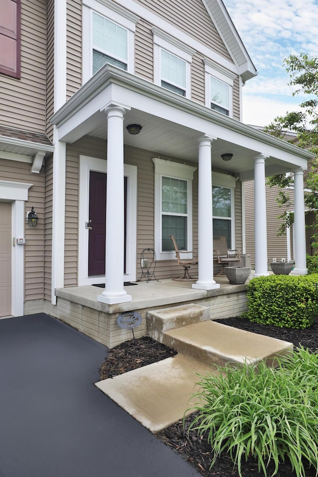 6134 Glade Run Rd, Hilliard, OH 43026 - view of exterior entry with a porch