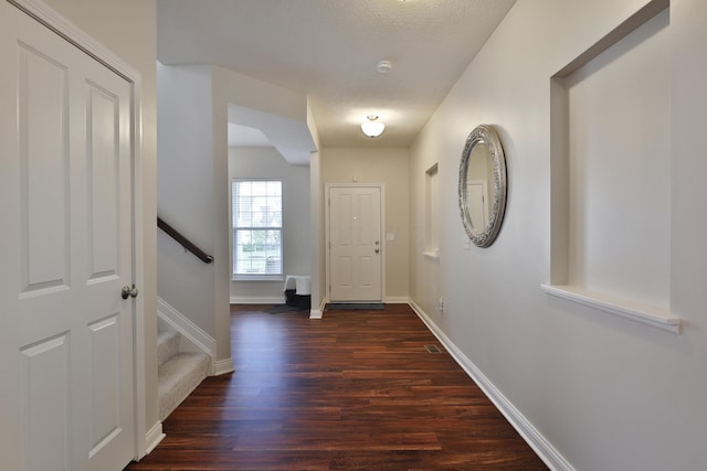 6134 Glade Run Rd, Hilliard, OH 43026 - hallway featuring dark wood-style flooring, baseboards, and stairs