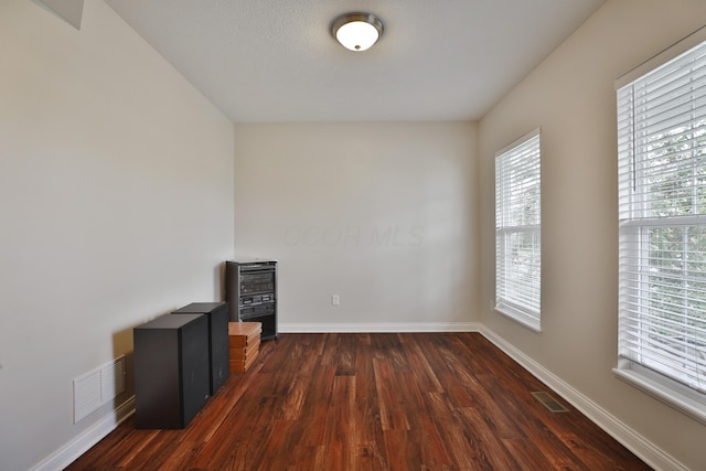 6134 Glade Run Rd, Hilliard, OH 43026 - spare room featuring dark wood-style flooring and baseboards
