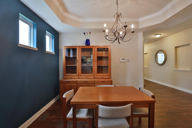 6134 Glade Run Rd, Hilliard, OH 43026 - dining room featuring a chandelier, dark wood-style floors, crown molding, and baseboards