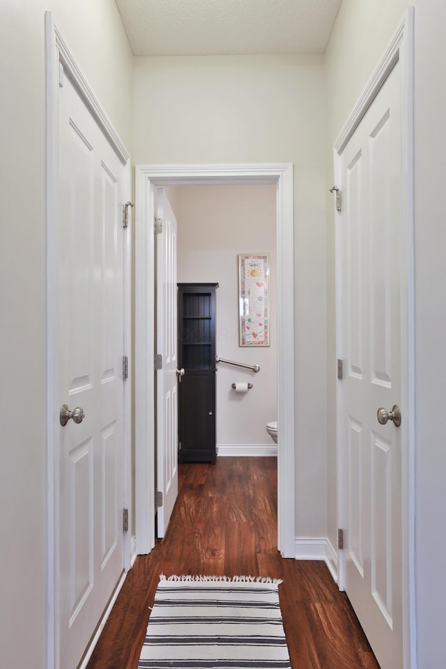 6134 Glade Run Rd, Hilliard, OH 43026 - corridor with dark wood-type flooring and baseboards